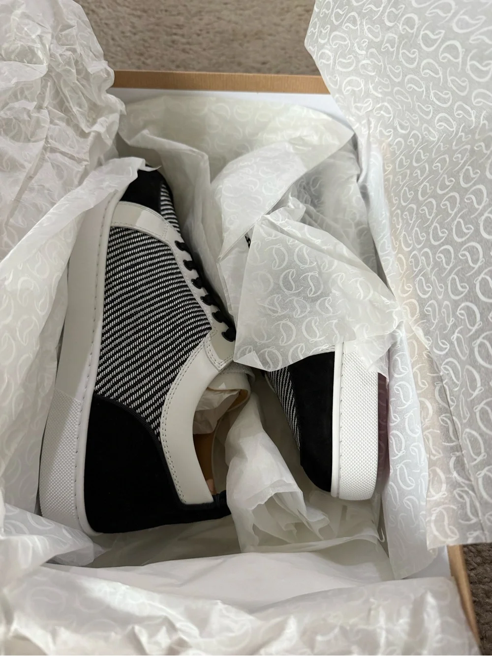 Christian Louboutin bought them